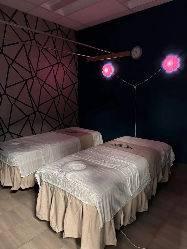 Two side-by-side massage tables in Pacific's couples room in Redmond.