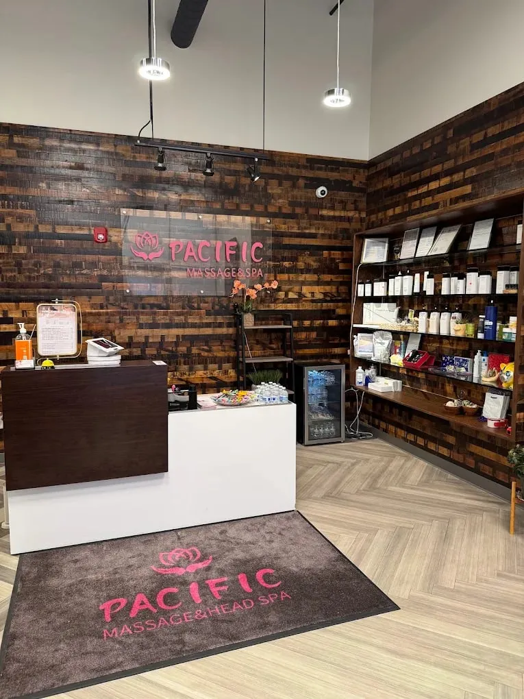 The reception desk and waiting area at Pacific Massage & Head Spa, where tiers are quoted and parking tickets are validated
